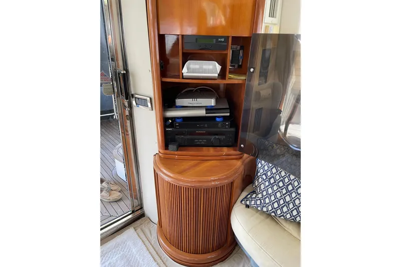 Slide: The Image of Interior of 2000 Azimut 46 Flybridge MY with wooden cabinet and electronic equipment. - 73