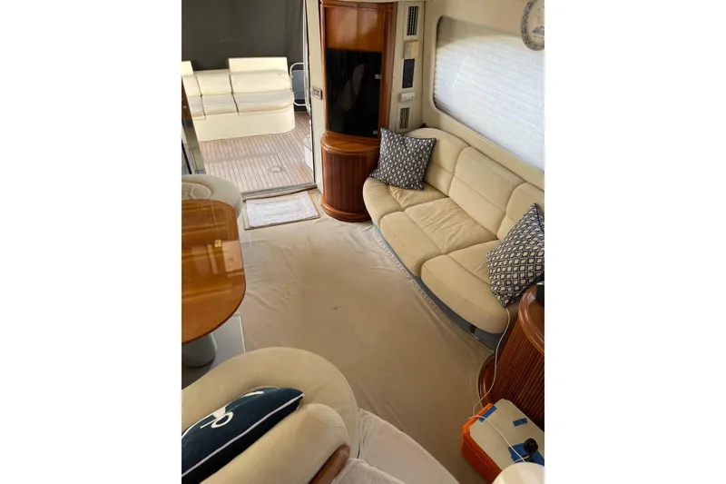 Slide: The Image of Luxurious interior of 2000 Azimut 46 Flybridge MY yacht with beige seating and wooden accents. - 74