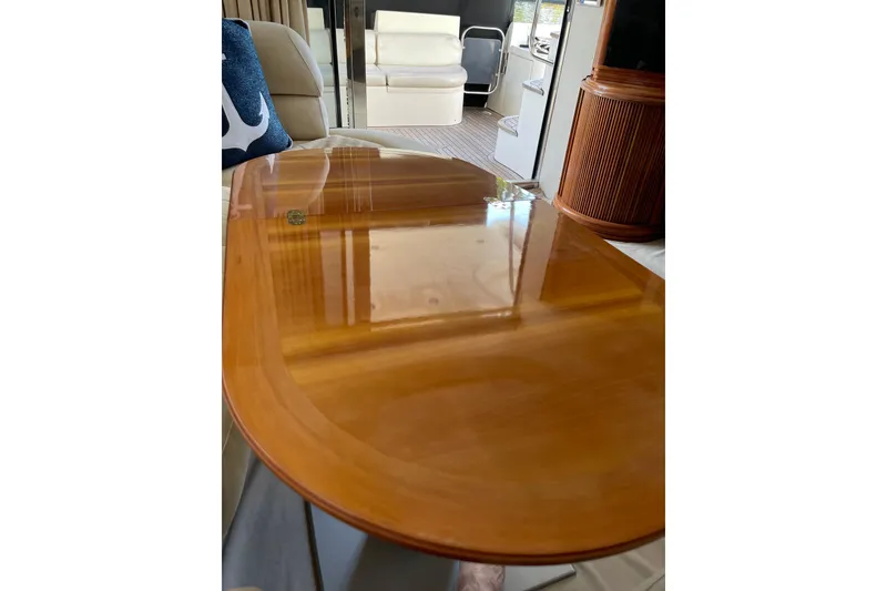 Slide: The Image of Luxurious interior of 2000 Azimut 46 Flybridge MY yacht with polished wooden table. - 75