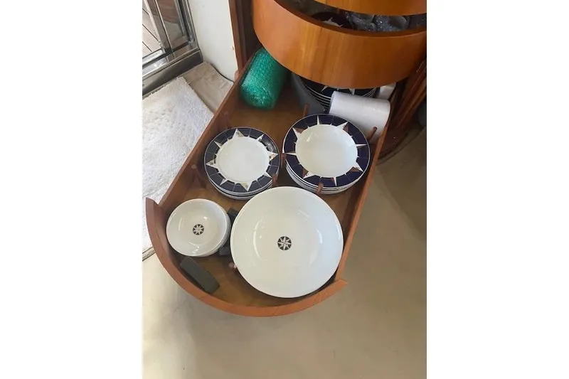 Slide: The Image of Dishes stored in a wooden drawer on a 2000 Azimut 46 Flybridge MY yacht. - 77
