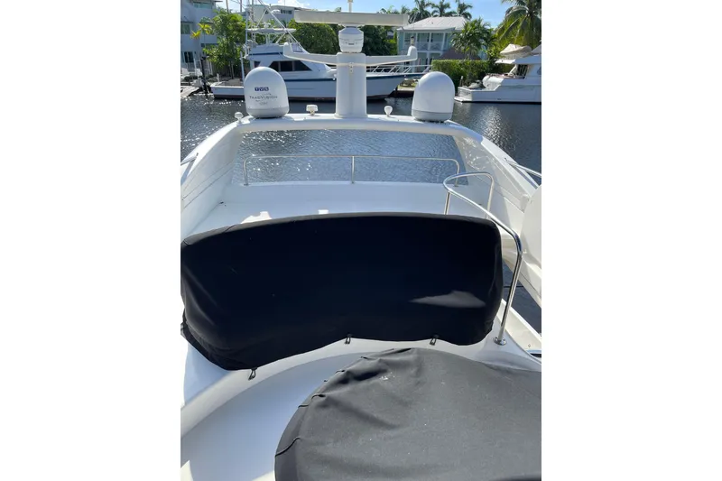 Slide: The Image of Azimut 46 Flybridge MY 2000 yacht deck with covered seating and navigation equipment. - 79
