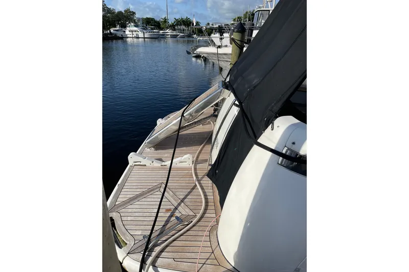 Slide: The Image of Azimut 46 Flybridge MY 2000 docked, showcasing deck and marina view. - 8