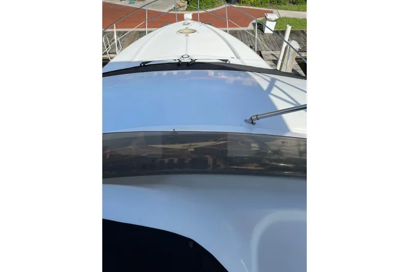 Slide: The Image of Azimut 46 Flybridge MY 2000 yacht deck view, showcasing sleek design and railing. - 82