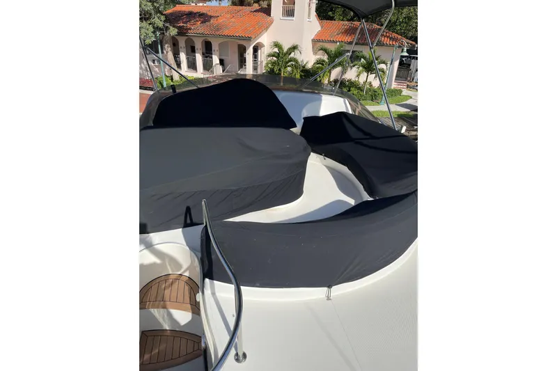 Slide: The Image of Azimut 46 Flybridge MY 2000 yacht with covered seating area on deck. - 84