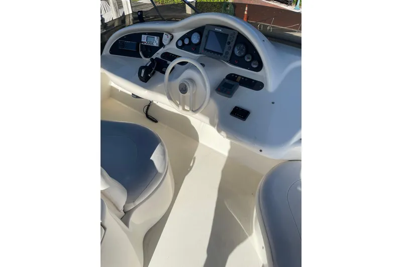 Slide: The Image of Flybridge helm of 2000 Azimut 46, featuring modern controls and navigation equipment. - 93