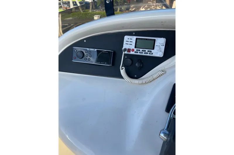 Slide: The Image of Control panel of 2000 Azimut 46 Flybridge MY yacht with radio and navigation equipment. - 94