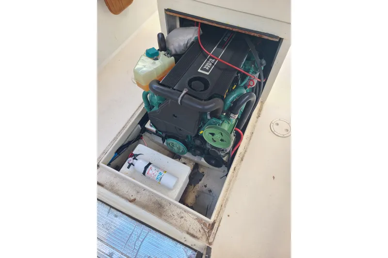 Slide: The Image of Engine compartment of a 1964 Holmes 25 Cuddy boat, featuring a Volvo Penta engine. - 10