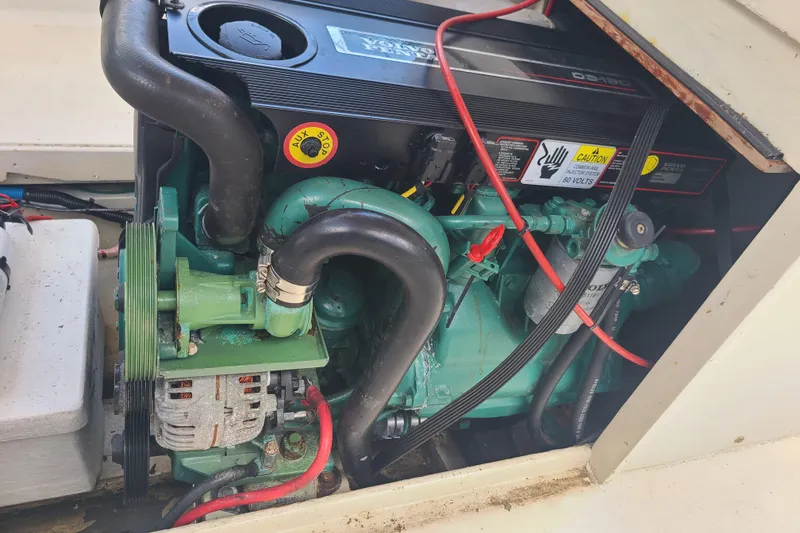 Slide: The Image of Engine compartment of a 1964 Holmes 25 Cuddy boat, featuring a Volvo Penta engine. - 23