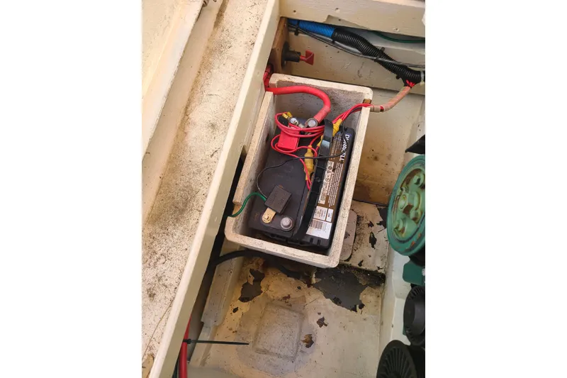 Slide: The Image of Battery compartment of a 1964 Holmes 25 Cuddy boat with visible wiring. - 26
