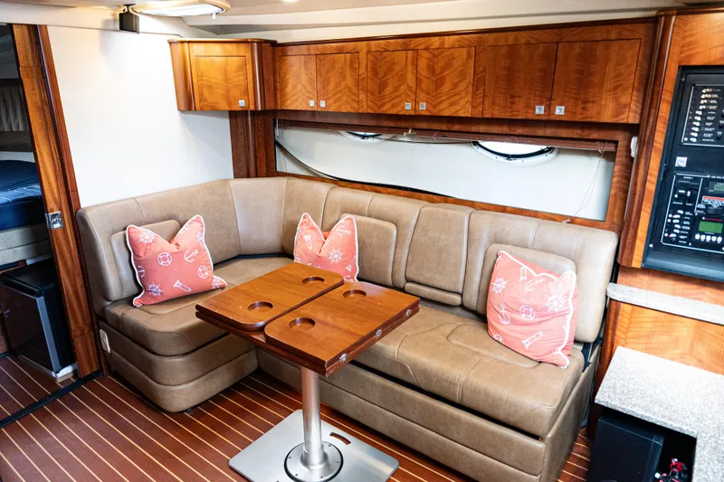Slide: The Image of Luxurious interior of 2008 Monterey 400 Sport Yacht with plush seating and nautical-themed pillows. - 10
