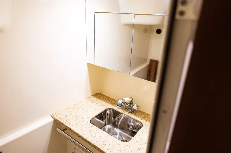Slide: The Image of Bathroom sink area in 2008 Monterey 400 Sport Yacht with granite countertop. - 14
