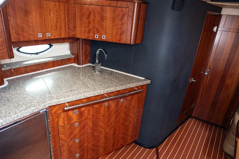 Slide: The Image of Luxurious wooden interior of 2008 Monterey 400 Sport Yacht kitchen area. - 17