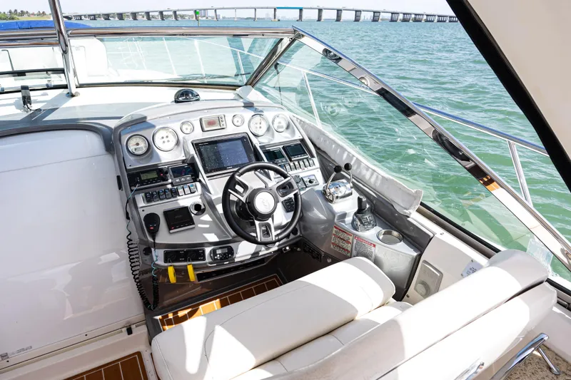 Slide: The Image of Cockpit of 2008 Monterey 400 Sport Yacht with modern navigation controls and ocean view. - 19