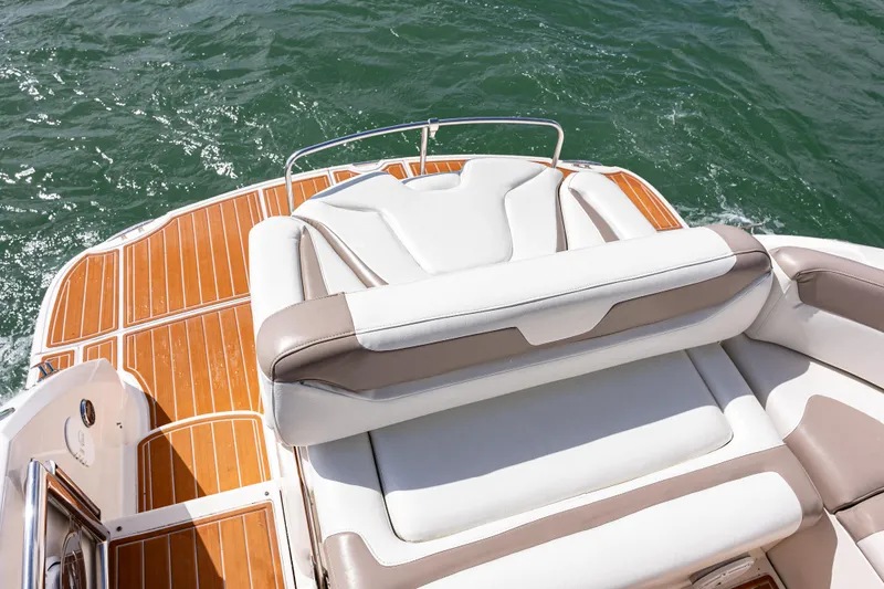 Slide: The Image of 2008 Monterey 400 Sport Yacht with teak deck and cushioned seating on water. - 23