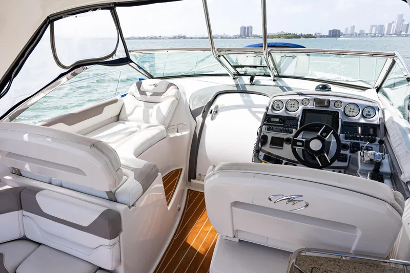 Slide: The Image of Luxurious 2008 Monterey 400 Sport Yacht interior with modern dashboard and plush seating. - 26