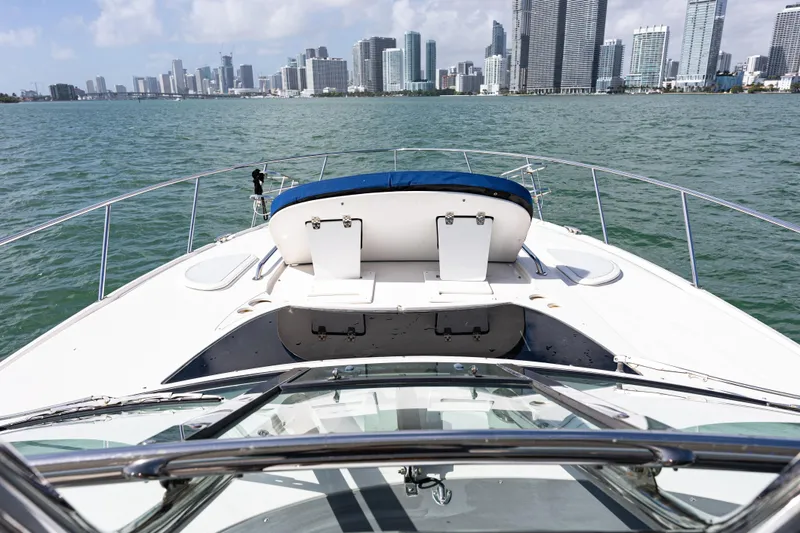 Slide: The Image of 2008 Monterey 400 Sport Yacht cruising with city skyline in background. - 29