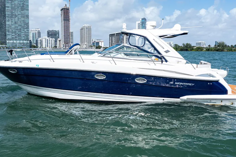 Slide: The Image of 2008 Monterey 400 Sport Yacht cruising near city skyline on a sunny day. - 3