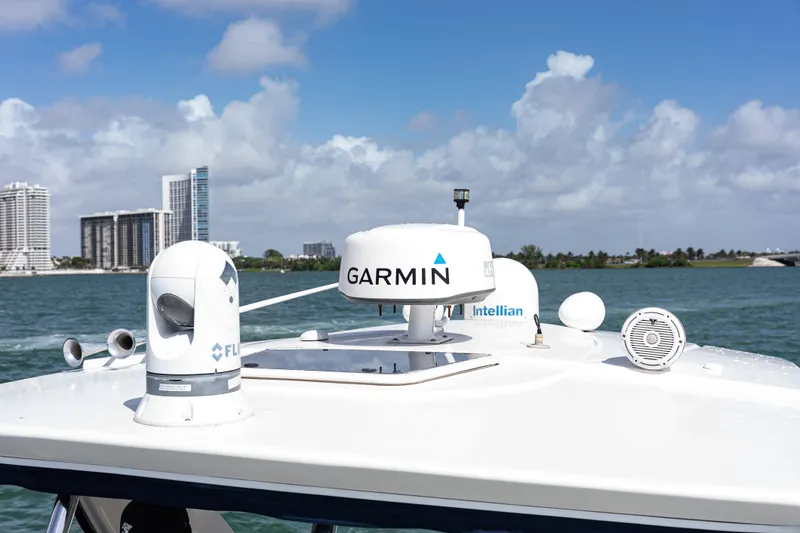 Slide: The Image of 2008 Monterey 400 Sport Yacht with Garmin and Intellian equipment on deck, city skyline background. - 37