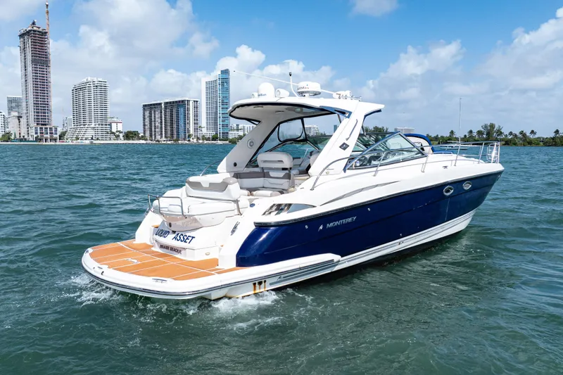 Slide: The Image of 2008 Monterey 400 Sport Yacht cruising near city skyline on a sunny day. - 4