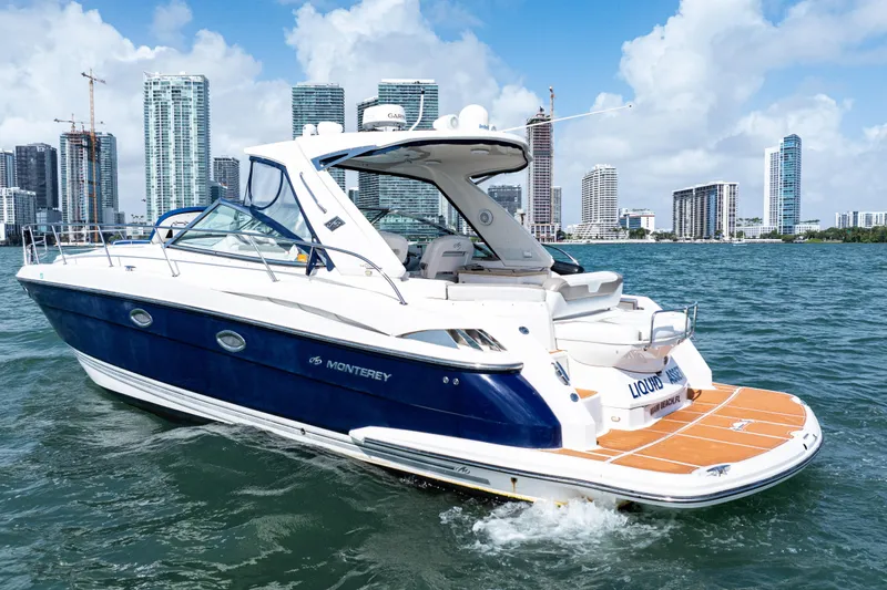 Slide: The Image of 2008 Monterey 400 Sport Yacht cruising near city skyline on a sunny day. - 5