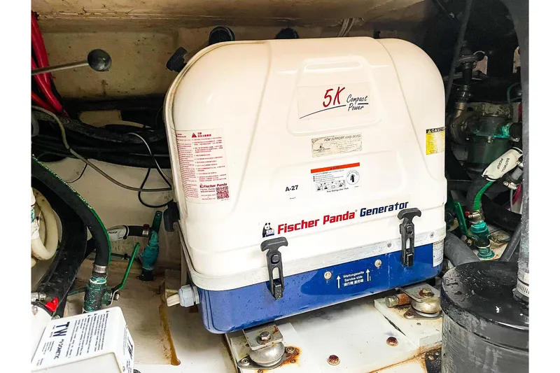 Slide: The Image of Fischer Panda generator in 2020 Pursuit OS 325 Offshore boat engine room. - 23