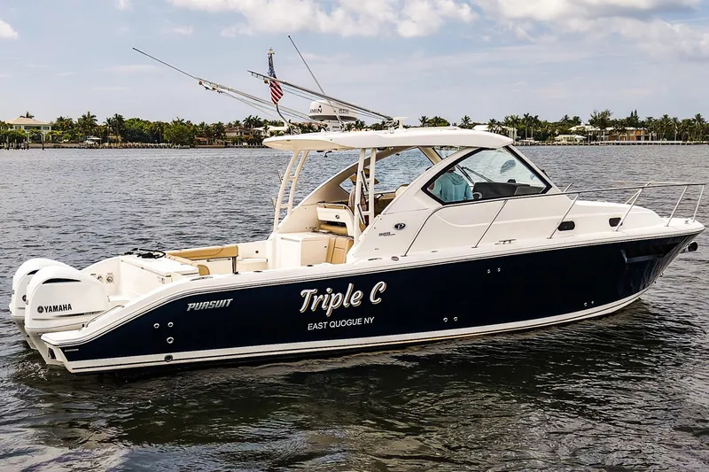 Slide: The Image of 2020 Pursuit OS 325 Offshore boat on water, featuring Yamaha engines and sleek design. - 42