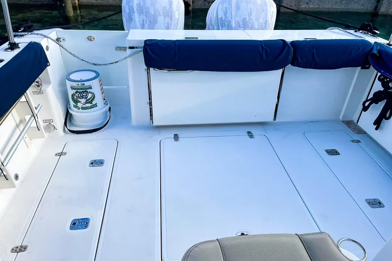 Slide: The Image of 2020 Pursuit OS 325 Offshore boat deck with storage compartments and seating. - 5