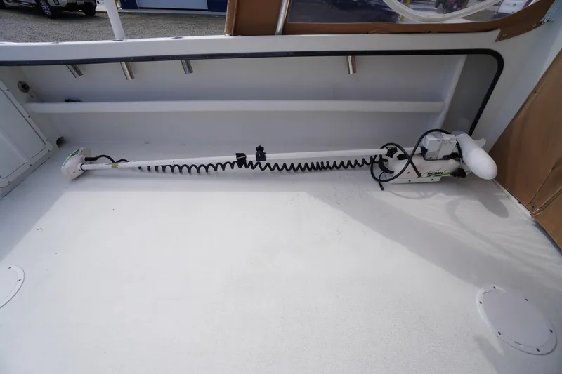 Slide: The Image of 2018 May-Craft 2700 Pilot XL boat interior with mounted equipment and clean deck. - 12