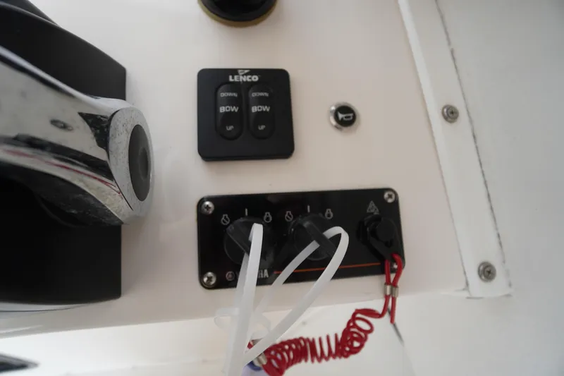 Slide: The Image of Control panel of a 2018 May-Craft 2700 Pilot XL boat with Lenco switches. - 19