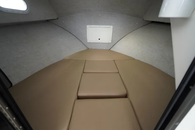 Slide: The Image of 2018 May-Craft 2700 Pilot XL cabin interior with beige cushions and compact design. - 22