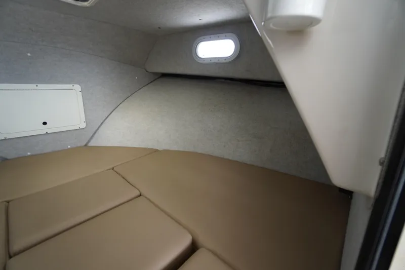 Slide: The Image of 2018 May-Craft 2700 Pilot XL cabin interior with cushioned seating and small window. - 23