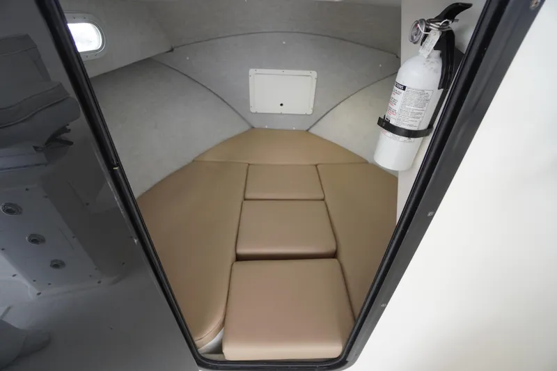 Slide: The Image of Interior cabin of 2018 May-Craft 2700 Pilot XL with beige cushions and fire extinguisher. - 25