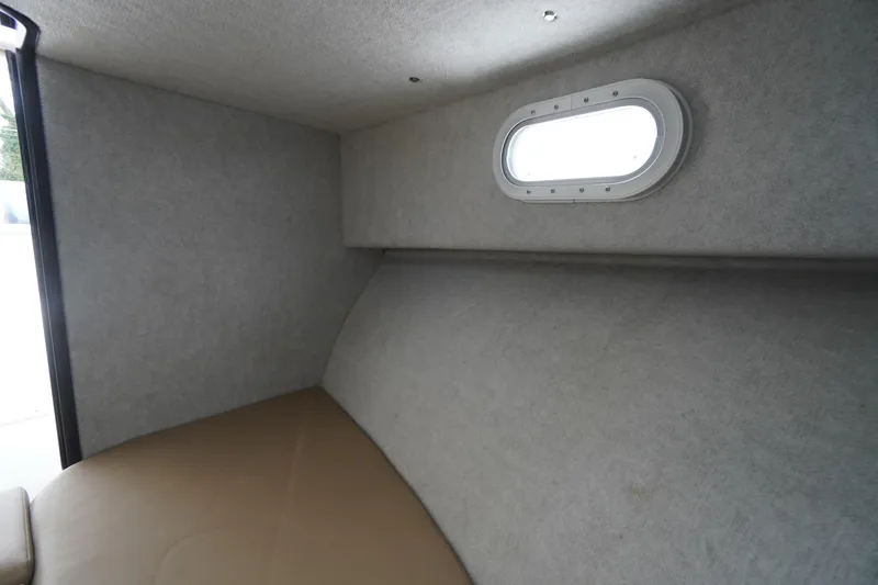 Slide: The Image of Interior cabin of 2018 May-Craft 2700 Pilot XL boat with porthole window. - 27