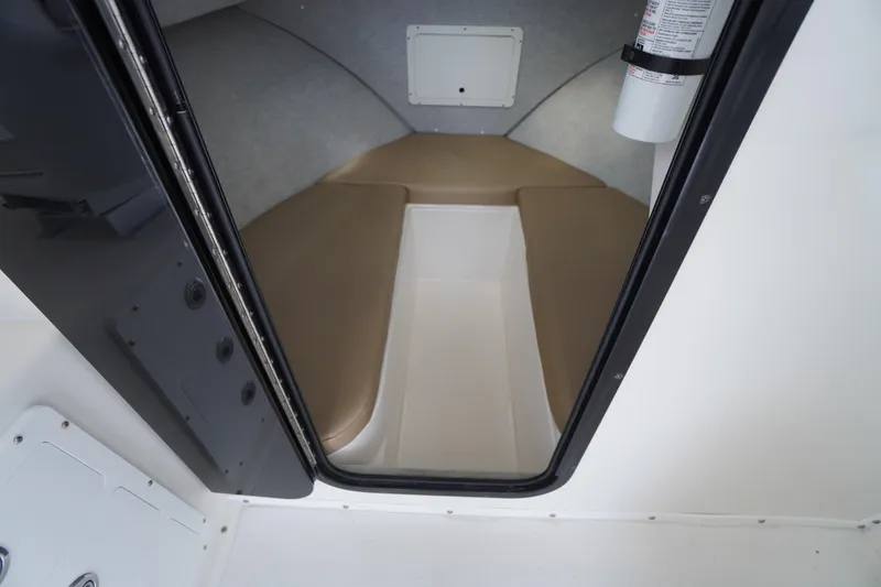 Slide: The Image of 2018 May-Craft 2700 Pilot XL cabin interior with beige cushions and fire extinguisher. - 29