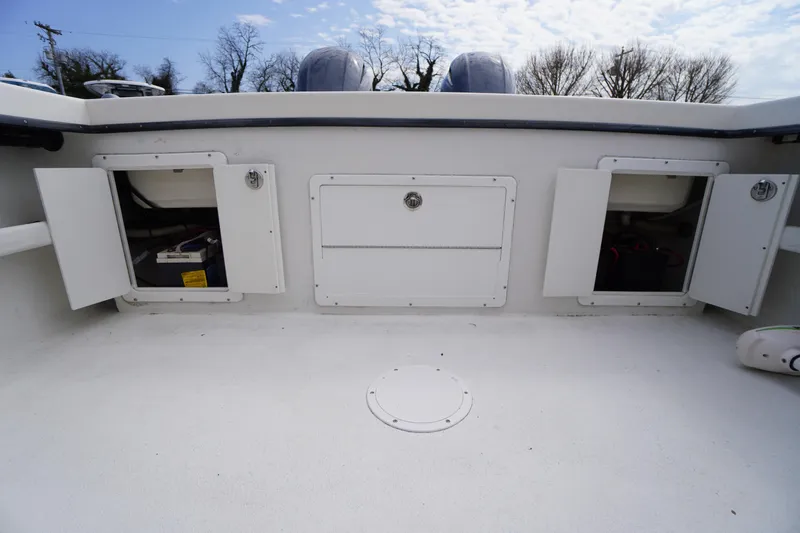 Slide: The Image of 2018 May-Craft 2700 Pilot XL boat deck with open storage compartments. - 30