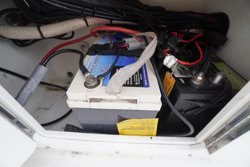 Slide: The Image of Battery compartment of a 2018 May-Craft 2700 Pilot XL boat with wiring connections. - 31