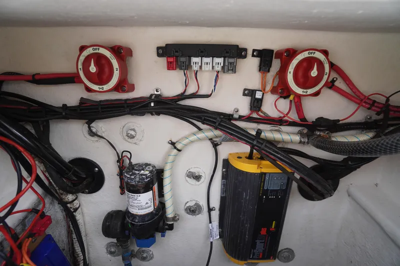 Slide: The Image of Electrical system of a 2018 May-Craft 2700 Pilot XL boat, featuring wiring and switches. - 33