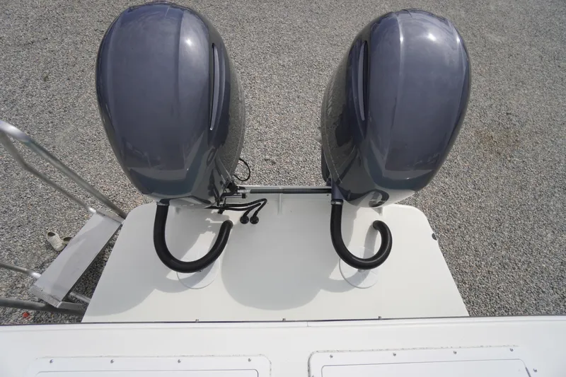 Slide: The Image of Twin outboard motors on a 2018 May-Craft 2700 Pilot XL boat, viewed from above. - 35