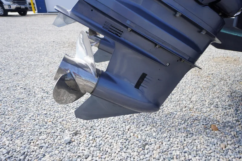 Slide: The Image of Close-up of a 2018 May-Craft 2700 Pilot XL boat propeller on gravel. - 43