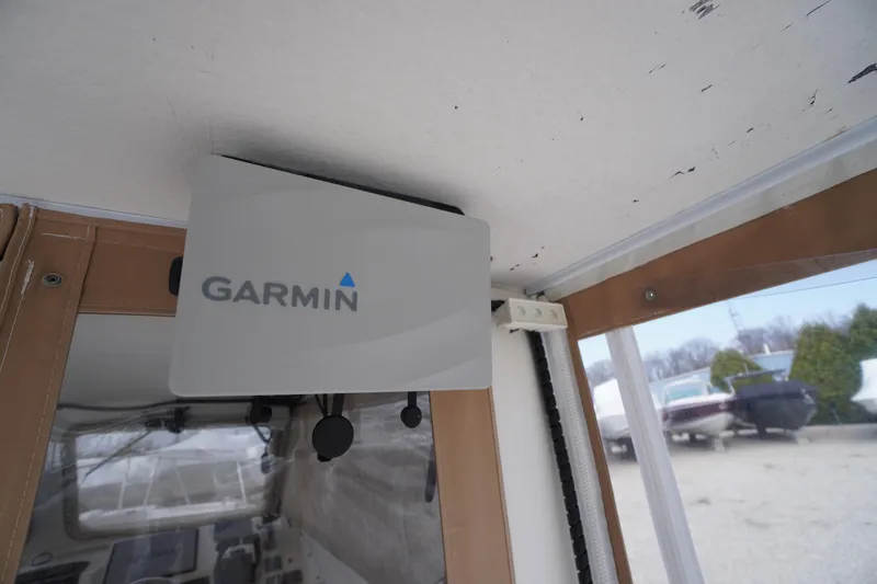 Slide: The Image of Garmin device installed on 2018 May-Craft 2700 Pilot XL boat interior. - 6