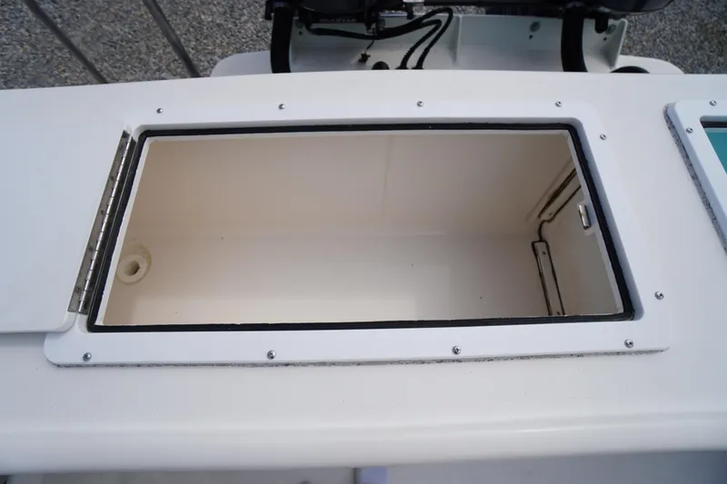 Slide: The Image of Open storage compartment on 2018 May-Craft 2700 Pilot XL boat. - 9