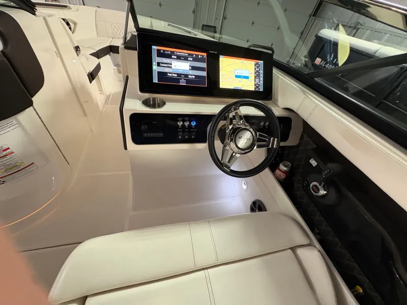 Slide: The Image of Interior of 2021 Sea Ray SLX 280 boat with modern helm console. - 11