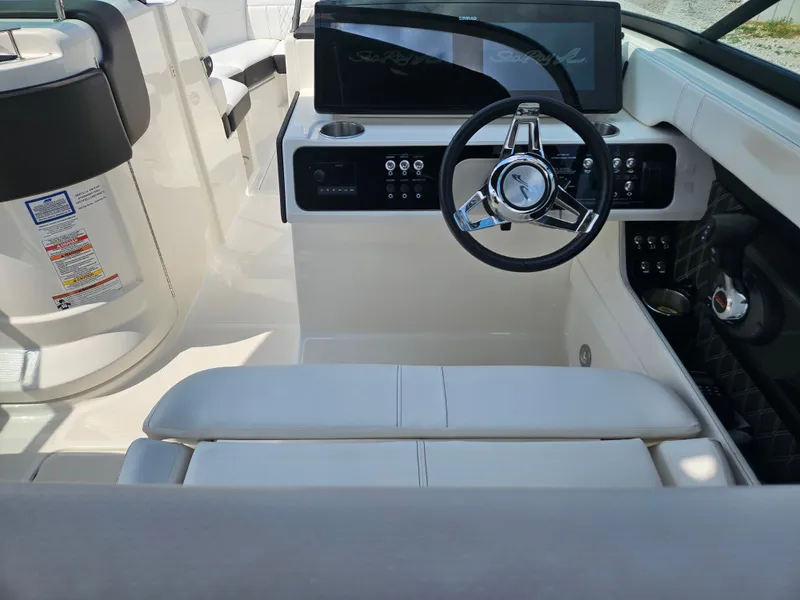 Slide: The Image of Interior of 2021 Sea Ray SLX 280 boat with modern helm station. - 12