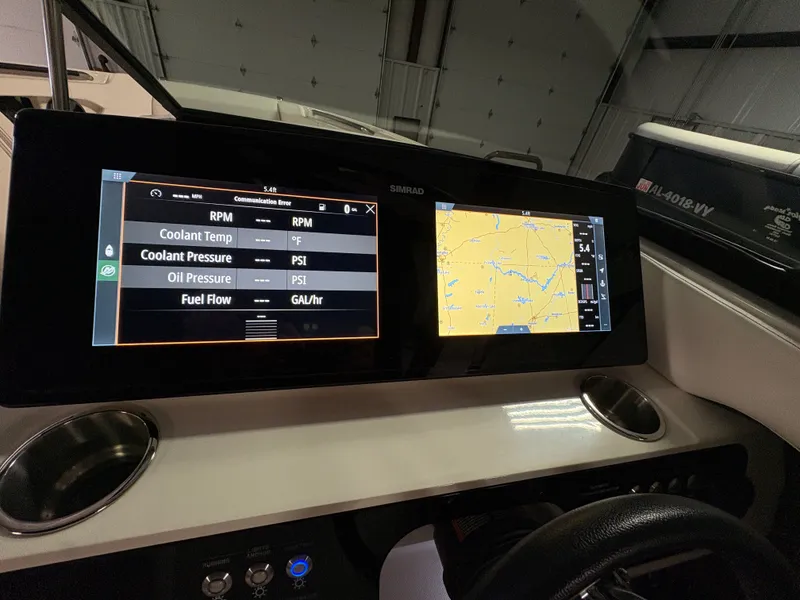 Slide: The Image of 2021 Sea Ray SLX 280 boat dashboard with Simrad displays. - 15