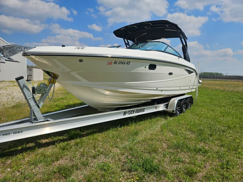 Slide: The Image of 2021 Sea Ray SLX 280 boat on trailer outdoors. - 2