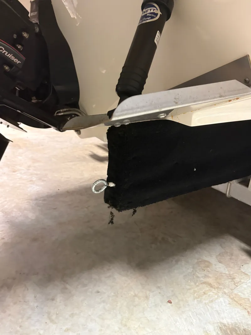 Slide: The Image of Sea Ray SLX 280 2021 boat with damaged trim tab area. - 26