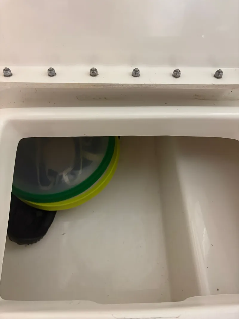 Slide: The Image of Interior of a 2021 Sea Ray SLX 280 boat with storage compartment. - 34