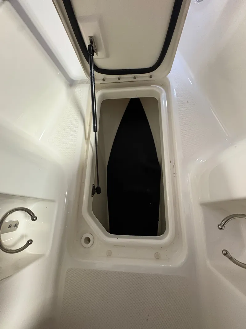 Slide: The Image of Interior of a 2021 Sea Ray SLX 280 boat with storage compartment. - 37