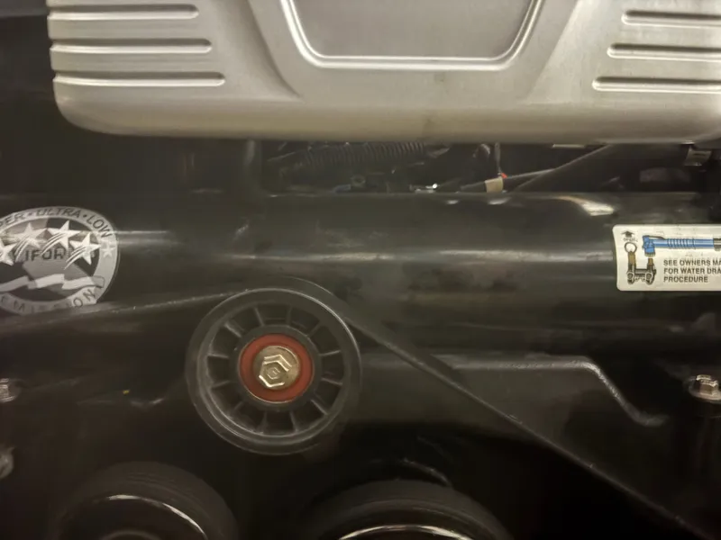 Slide: The Image of Close-up of a 2021 Sea Ray SLX 280 engine. - 48