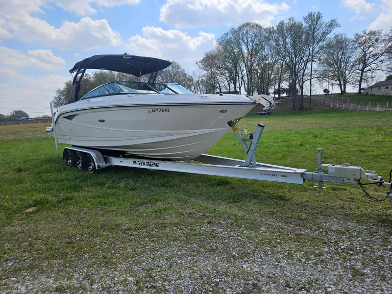 Slide: The Image of 2021 Sea Ray SLX 280 boat on trailer outdoors. - 5